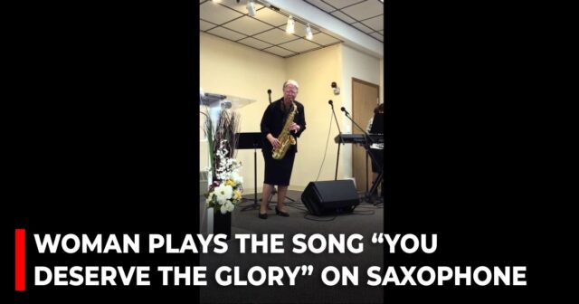 Woman plays the song “You deserve the glory” on saxophone